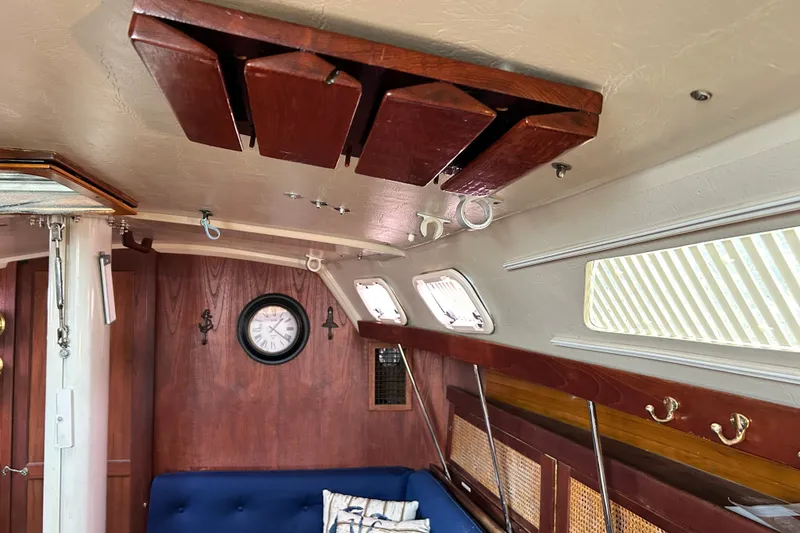 Slide: The Image of Interior of 1988 Catalina 34 sailboat with wooden accents and nautical decor. - 28