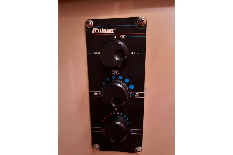 Slide: The Image of Control panel of a 1988 Catalina 34 sailboat with Cruisair system knobs. - 44