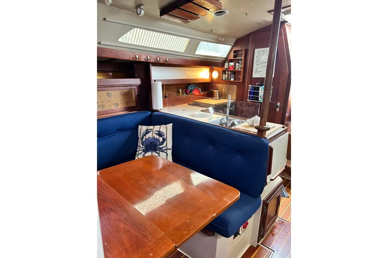 Slide: The Image of Interior of 1988 Catalina 34 sailboat with cozy dining area and kitchen. - 19