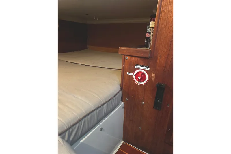 Slide: The Image of The image shows a cozy cabin with a double bed and wooden walls. - 37
