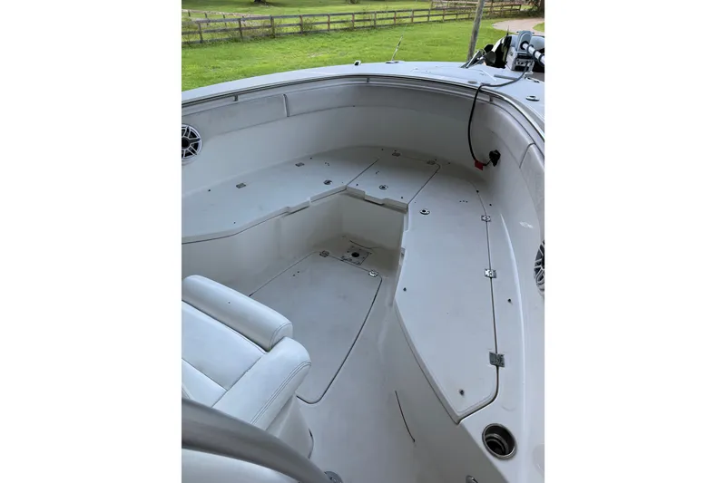Slide: The Image of 2007 Robalo R300 Center Console boat interior with seating and storage compartments. - 10