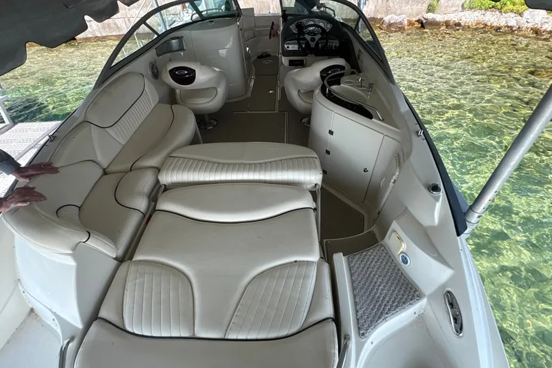 Slide: The Image of Interior of a 2005 Azure AZ240 boat with white seating and clear water view. - 4