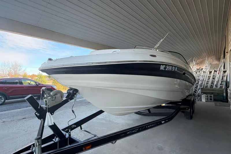 Slide: The Image of 2005 Azure AZ240 boat on trailer under shelter, side view. - 3