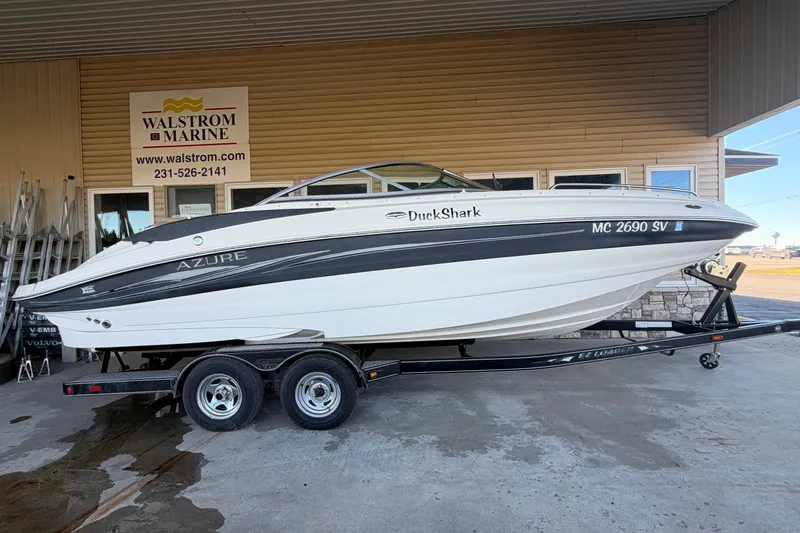 The Image of 2005 Azure AZ240 boat on trailer at Walstrom Marine dealership. - 0