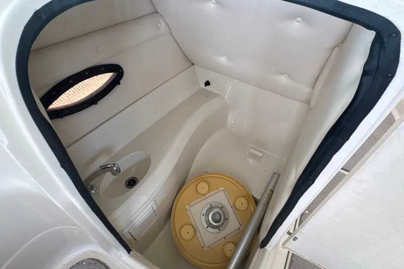 Slide: The Image of Compact boat bathroom with sink and porthole in 2005 Azure AZ240 model. - 12