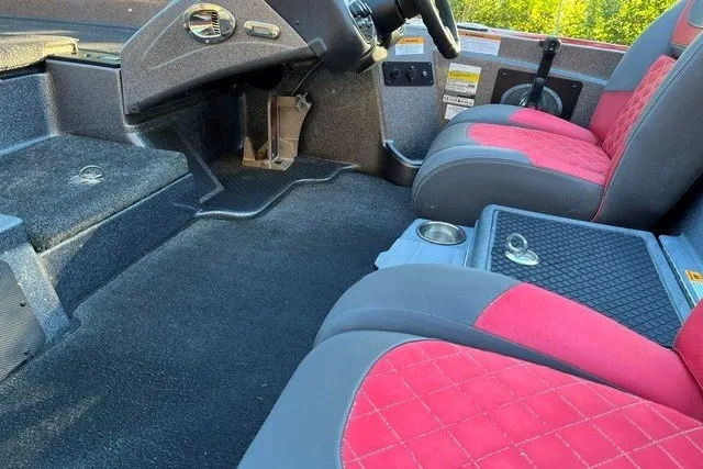 Slide: The Image of Interior of 2018 Triton 189 TrX boat with red and gray seating. - 15
