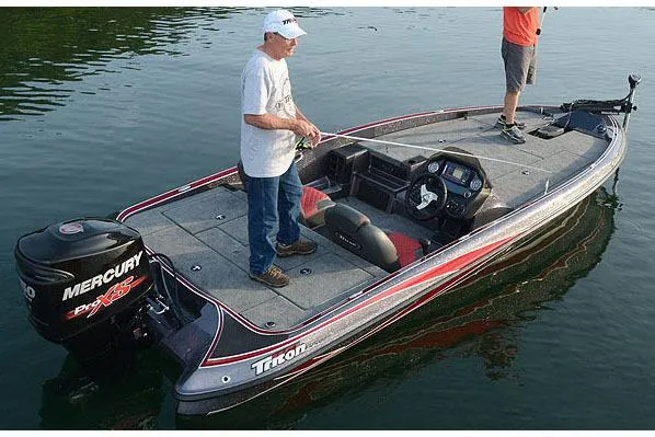 Slide: The Image of Manufacturer Provided Image: 2018 Triton 189 TrX boat with Mercury engine on calm water, two people fishing. - 24