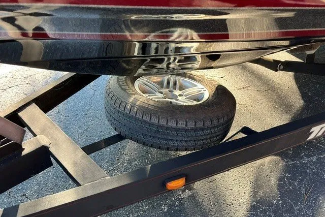 Slide: The Image of 2018 Triton 189 TrX boat trailer with spare tire mounted underneath. - 20