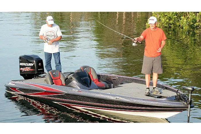 Slide: The Image of Manufacturer Provided Image: Two people fishing on a 2018 Triton 189 TrX boat in a calm lake. - 22