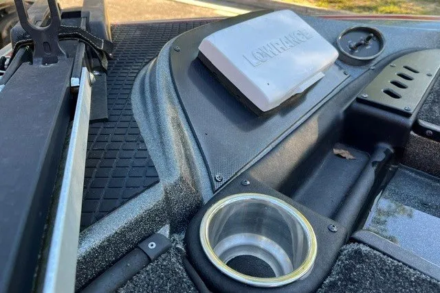 Slide: The Image of 2018 Triton 189 TrX boat dashboard with Lowrance device and cup holder. - 18
