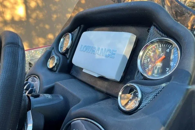 Slide: The Image of Dashboard of 2018 Triton 189 TrX with Lowrance display and gauges. - 13