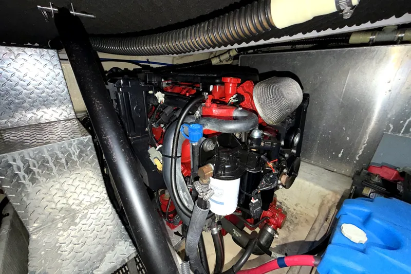Slide: The Image of Engine compartment of a 2006 Regal Commodore 3760 IO boat, featuring detailed components. - 28