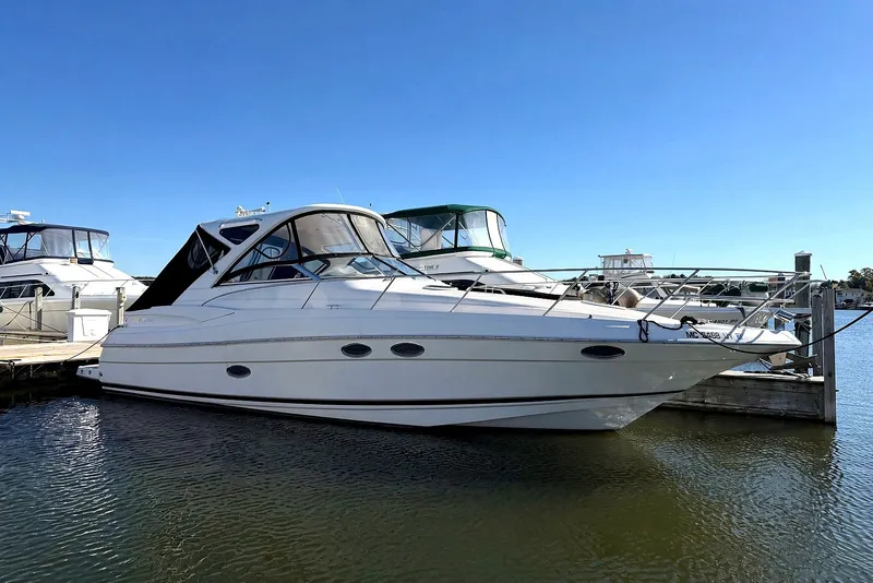 The Image of 2006 Regal Commodore 3760 IO boat docked at marina under clear blue sky. - 0