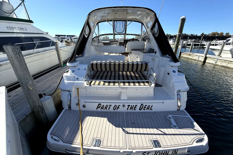 Slide: The Image of 2006 Regal Commodore 3760 IO yacht docked at marina, rear view. - 2
