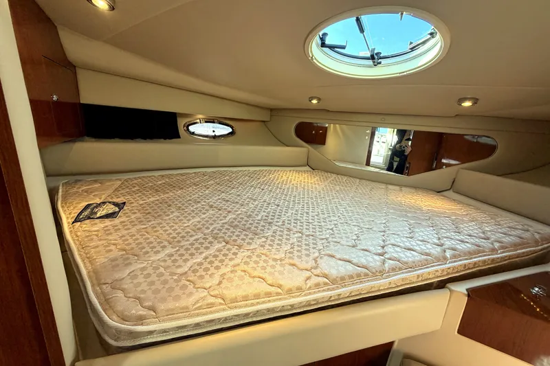 Slide: The Image of Luxurious cabin interior of 2006 Regal Commodore 3760 IO yacht with plush bedding. - 20
