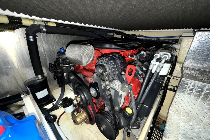 Slide: The Image of Engine compartment of a 2006 Regal Commodore 3760 IO boat, showcasing mechanical components. - 27