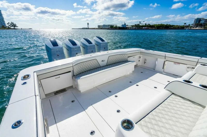 Slide: The Image of Luxurious 2025 Valhalla V-55 boat with spacious deck and quad outboard engines on open water. - 7