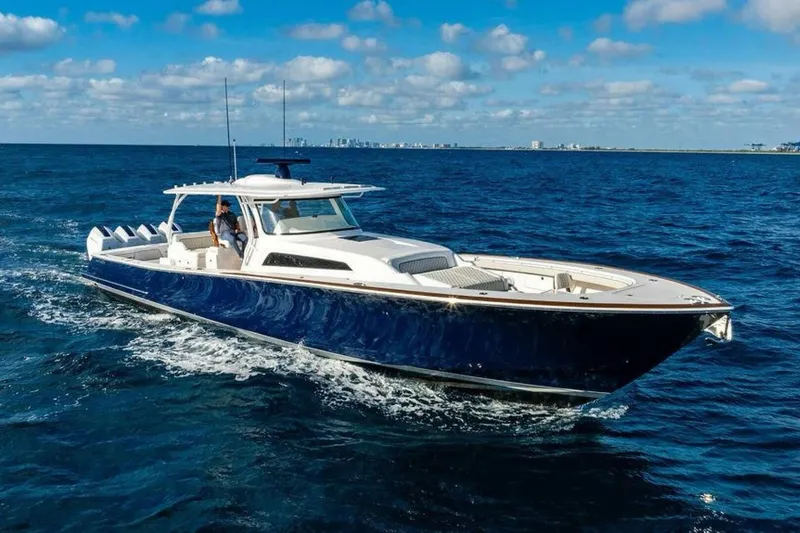 The Image of 2025 Valhalla V-55 yacht cruising on open ocean under blue sky. - 1