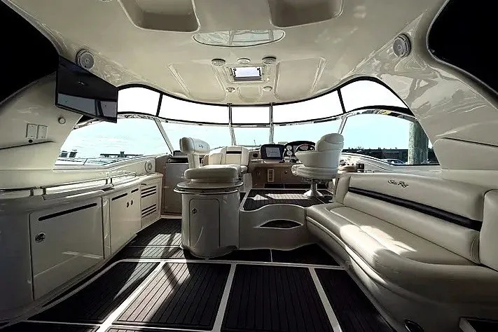 Slide: The Image of Luxurious interior of a 2003 Sea Ray 500 Sundancer yacht with elegant seating and modern amenities. - 5