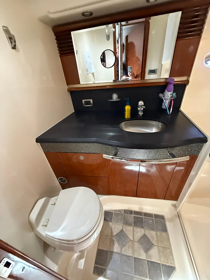 Slide: The Image of Luxurious bathroom in 2003 Sea Ray 500 Sundancer yacht with modern fixtures and elegant design. - 25