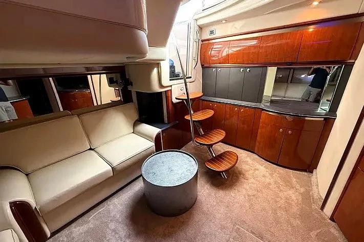 Slide: The Image of Luxurious interior of a 2003 Sea Ray 500 Sundancer yacht with elegant wood finishes. - 14