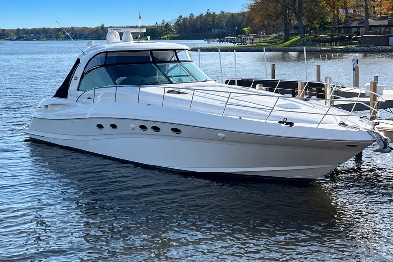 The Image of 2003 Sea Ray 500 Sundancer yacht docked on a serene lake. - 0