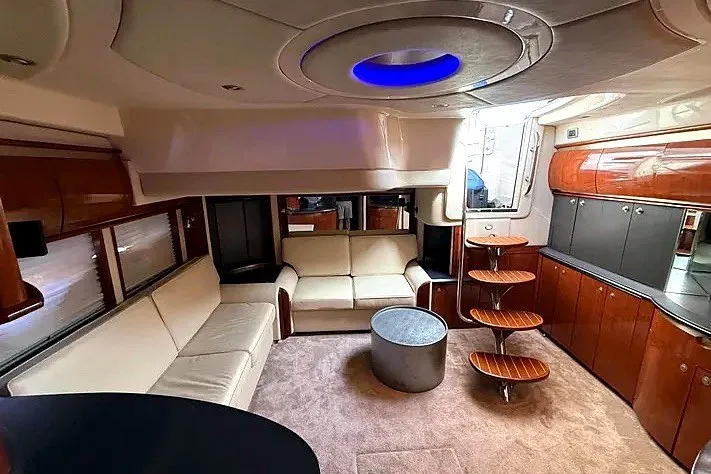Slide: The Image of Luxurious interior of a 2003 Sea Ray 500 Sundancer yacht with modern furnishings. - 15