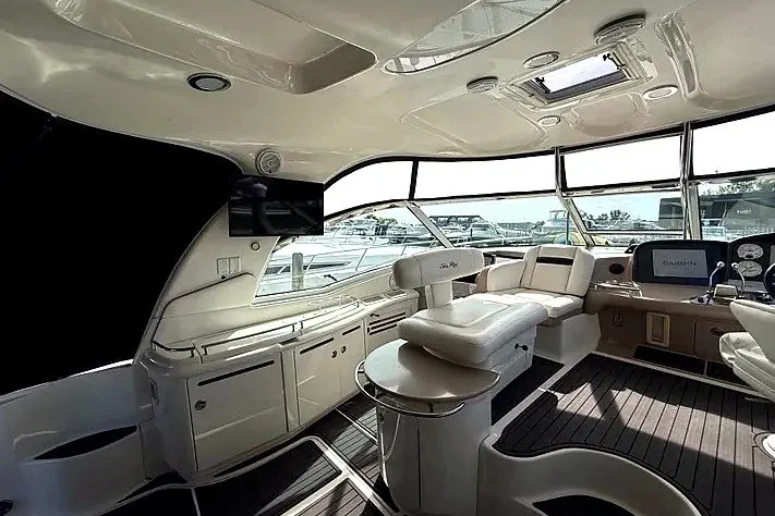 Slide: The Image of Luxurious interior of 2003 Sea Ray 500 Sundancer yacht with modern amenities and seating. - 6