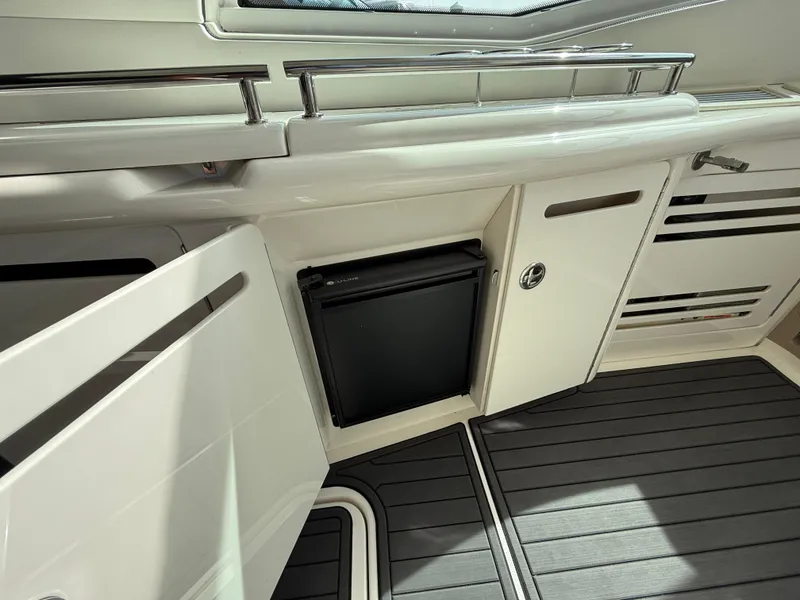 Slide: The Image of 2003 Sea Ray 500 Sundancer yacht interior with sleek cabinetry and flooring. - 12