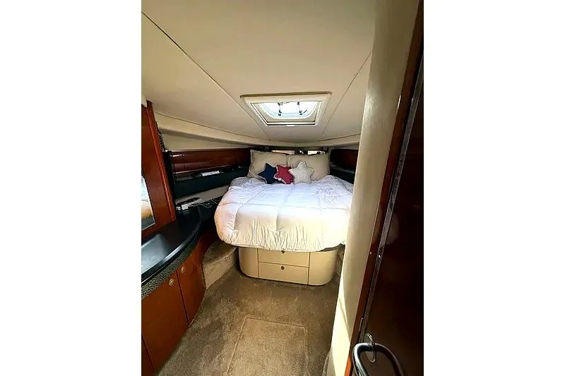 Slide: The Image of Luxurious cabin interior of 2003 Sea Ray 500 Sundancer yacht with cozy bedding. - 19