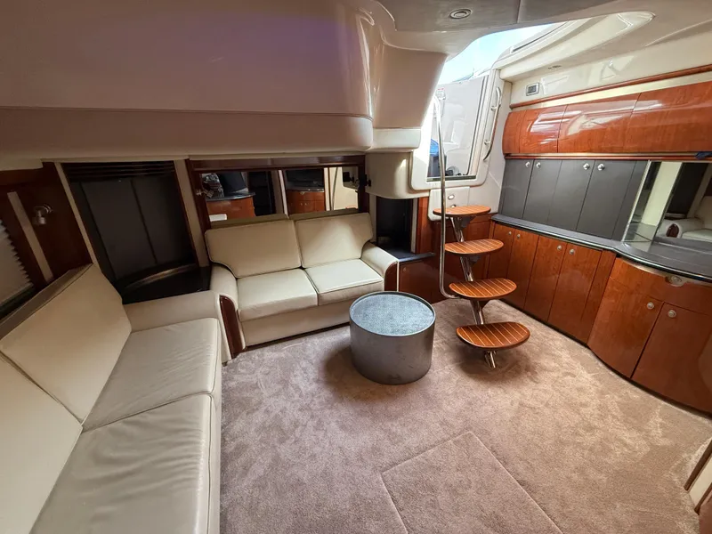 Slide: The Image of Luxurious interior of 2003 Sea Ray 500 Sundancer yacht with plush seating and modern design. - 17