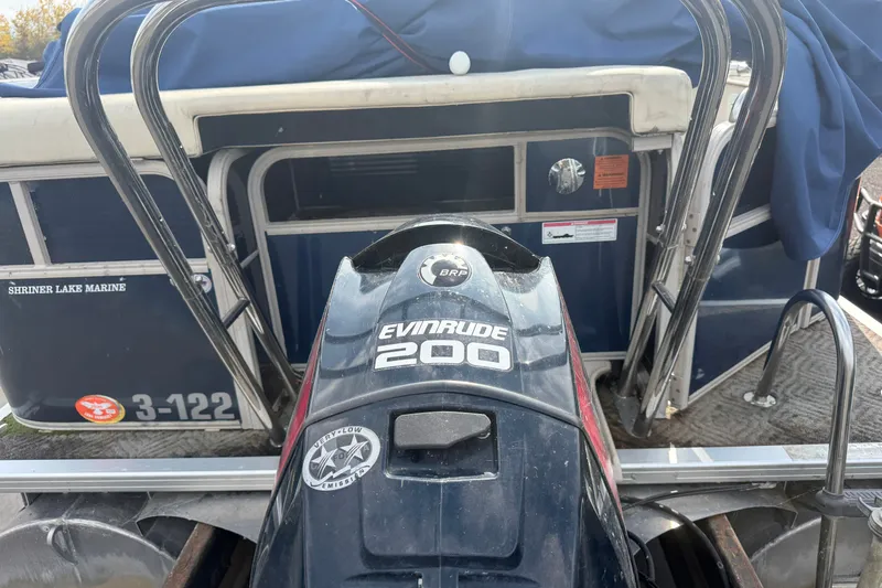 Slide: The Image of 2010 Sylvan 8525 Mandalay boat with Evinrude 200 engine at dock. - 6