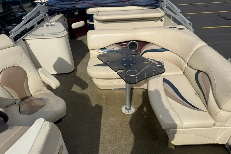 Slide: The Image of Interior of 2010 Sylvan 8525 Mandalay pontoon boat with seating and table. - 12