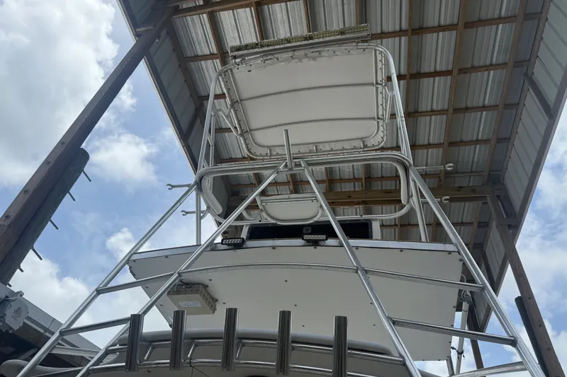 Slide: The Image of 1995 Cabo 35 Express boat under a metal roof, viewed from below. - 20