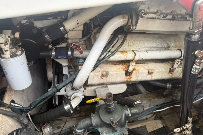 Slide: The Image of Engine compartment of a 1995 Cabo 35 Express boat with Caterpillar components. - 17