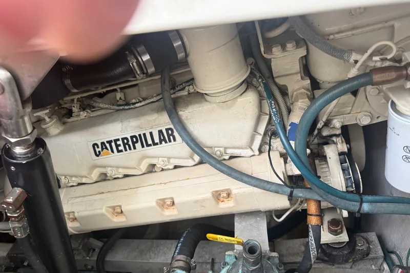 Slide: The Image of Engine compartment of a 1995 Cabo 35 Express with Caterpillar components. - 18