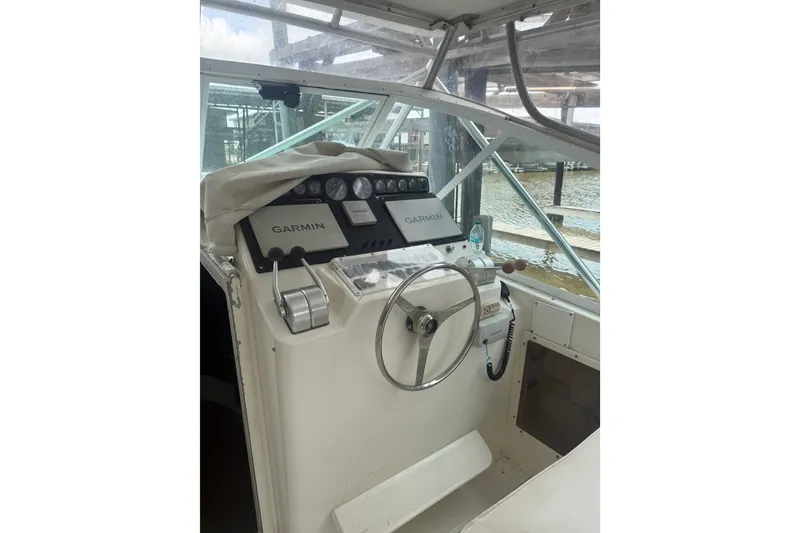 Slide: The Image of 1995 Cabo 35 Express boat helm with Garmin navigation system. - 13