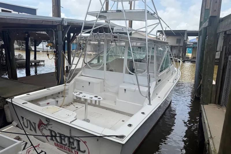 Slide: The Image of 1995 Cabo 35 Express boat docked in Galveston, Texas marina. - 3