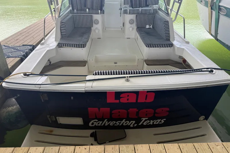 Slide: The Image of 2002 Mainship Pilot 34 boat named "Lab Mates" docked in Galveston, Texas. - 27
