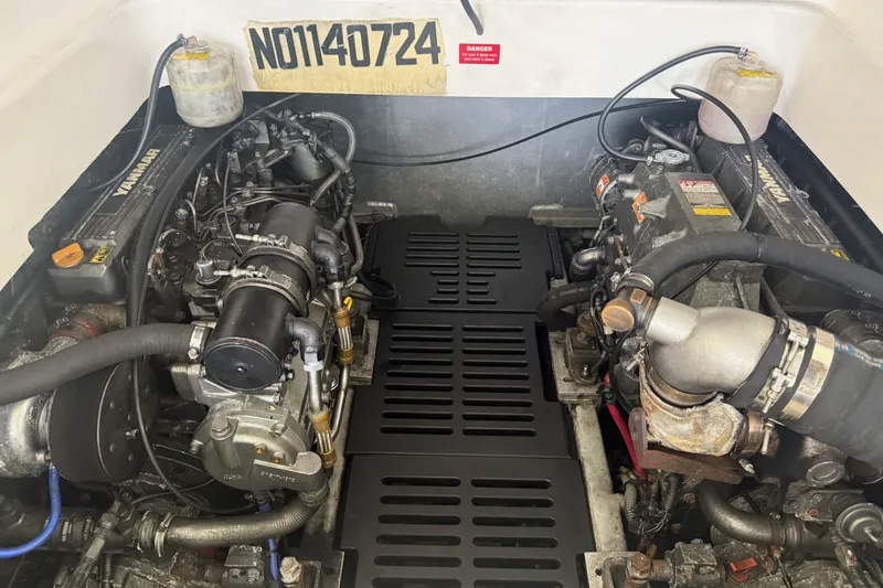 Slide: The Image of Engine compartment of a 2002 Mainship Pilot 34 with dual Yanmar engines. - 25