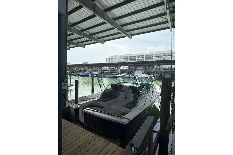 Slide: The Image of 2002 Mainship Pilot 34 docked in a covered marina, Galveston, Texas. - 4