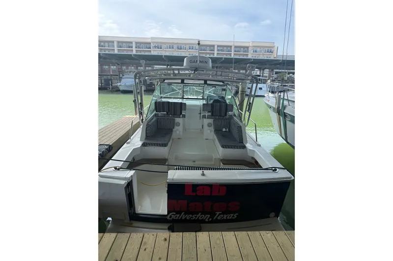 Slide: The Image of 2002 Mainship Pilot 34 boat docked in Galveston, Texas marina. - 1
