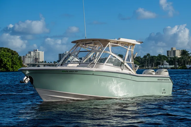 The Image of 2024 Grady-White Freedom 275 boat on water, clear sky background. - 1