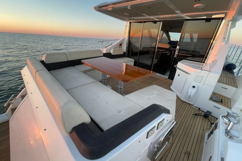 Slide: The Image of AFT COCKPIT LOUNGE SEATING WITH HI/LO TABLE, TEAK DECKS, & WETBAR WITH FRIDGE & ELECTRIC GRILL!! - 19