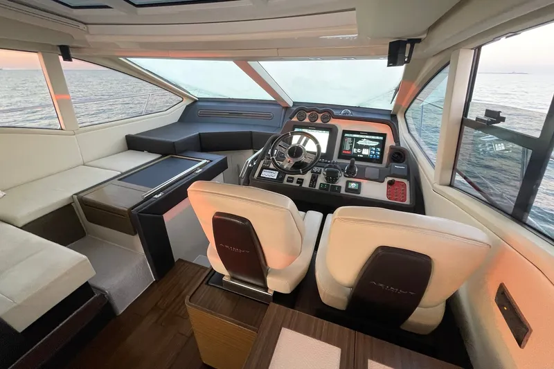Slide: The Image of HELM DECK WITH TWIN CAPTAINS CHAIRS WITH FLIP-UP BOLSTERS & ELECTRICALLY ADJUSTABLE - 16