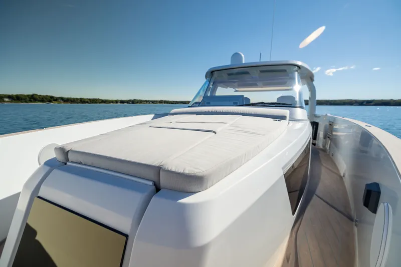 Slide: The Image of 2023 Fjord 41 XL luxury yacht on calm waters under clear blue sky. - 41