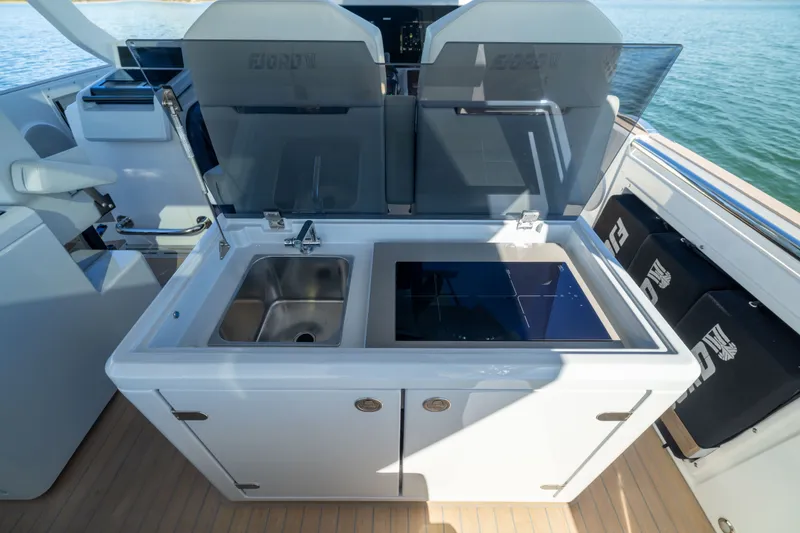 Slide: The Image of Outdoor kitchen on 2023 Fjord 41 XL yacht with sink and stove, overlooking water. - 25
