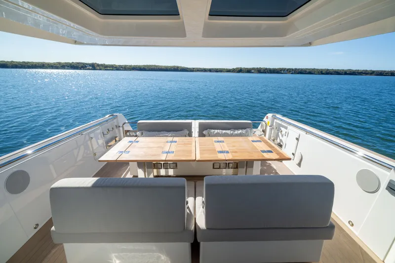 Slide: The Image of Luxurious 2023 Fjord 41 XL yacht deck with seating and ocean view. - 18