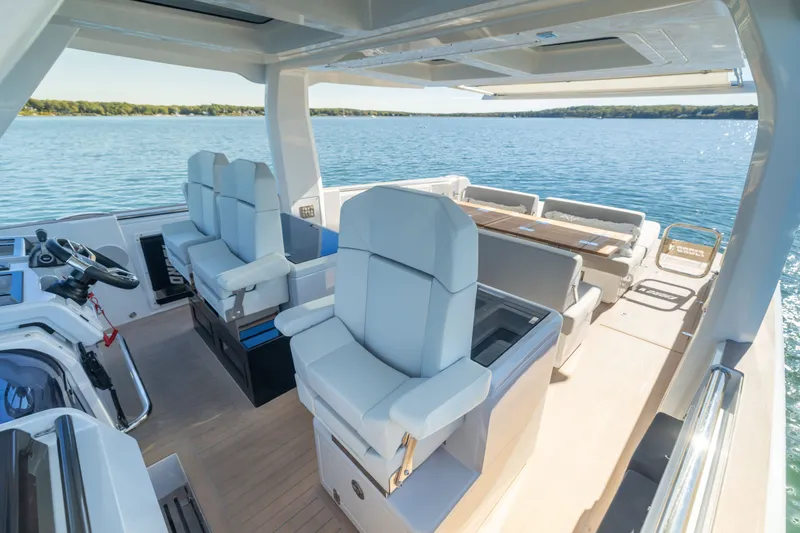 Slide: The Image of Luxurious 2023 Fjord 41 XL yacht interior with modern seating and scenic ocean view. - 39