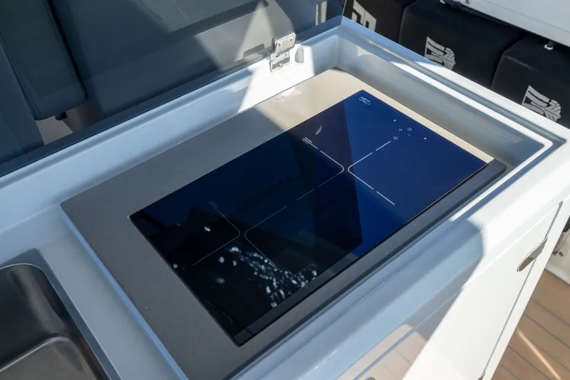 Slide: The Image of Modern stovetop on 2023 Fjord 41 XL yacht, featuring sleek design and advanced technology. - 26